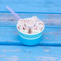 Unicorn Ice Cream · Vanilla base, fruity pebbles, and white chocolate drizzle.