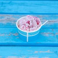 Strawberry Cheesecake Ice Cream · Vanilla ice cream base, strawberries, cheesecake, and white chocolate drizzle.