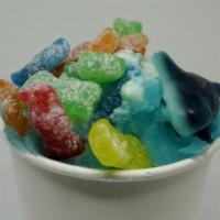 Shark Attack Shaved Ice · Polar punch shaved ice, a scoop of vanilla ice cream, sour patch kids, and gummy shark.