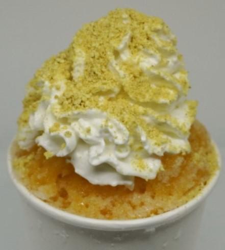 Pumpkin Spice Shaved Ice · Pumpkin shaved ice, a scoop of vanilla ice cream, whipped cream, and graham cracker crumbs.
