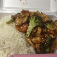64. Chicken with Broccoli · Served with white rice.