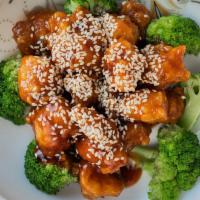 S2. Sesame Chicken · Crispy golden tender chicken with broccoli in house special sesame sauce. Served with white ...