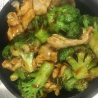 56. Chicken with Broccoli · Served with rice.