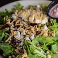 Cranberry Walnut Salad  · A fresh mix of salad greens, walnuts and dried cranberries topped with blue cheese crumbles ...