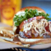 Kentucky Bourbon Classic Burger  · This tantalizing crowd-pleaser, adds cheddar cheese crowned with grilled onions, 2 slices of...
