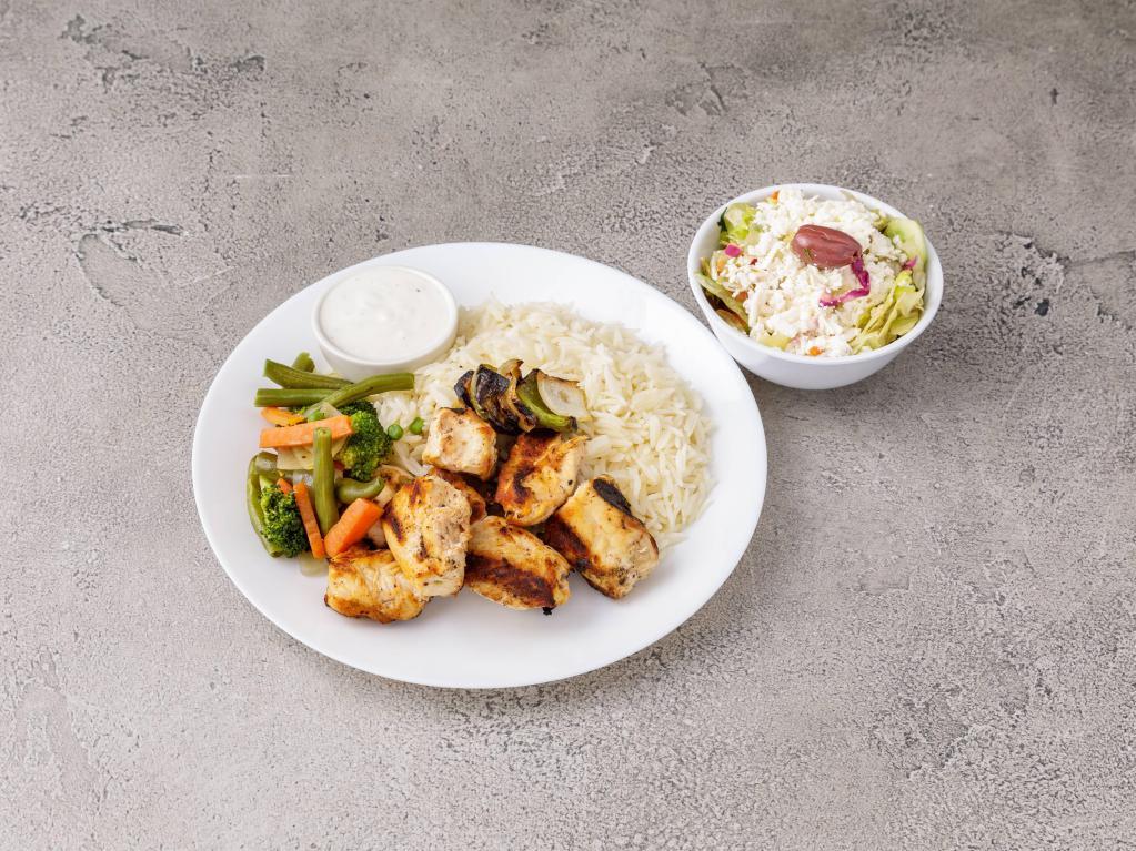 Chicken Kebabs · Cubes chicken breast marinated with yogurt and herbs, flame grilled on skewer. Served with basmati rice pilaf or cracked wheat bulgur, seasonal vegetables and cucumber yogurt sauce.