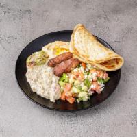 Energy Platter · Hummus, eggplant salad, felafel with tahina, tomato feta cucumber salad whole wheat pita.