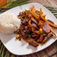 Lomo Saltado · Stir-fry marinated strips of steak or chicken mixed with onion, tomatoes, fries