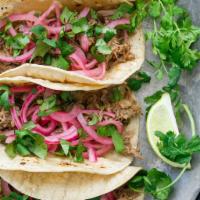 3 pork tacos · 3 Slow cooked pulled pork tacos, pickles onions, cilantro 