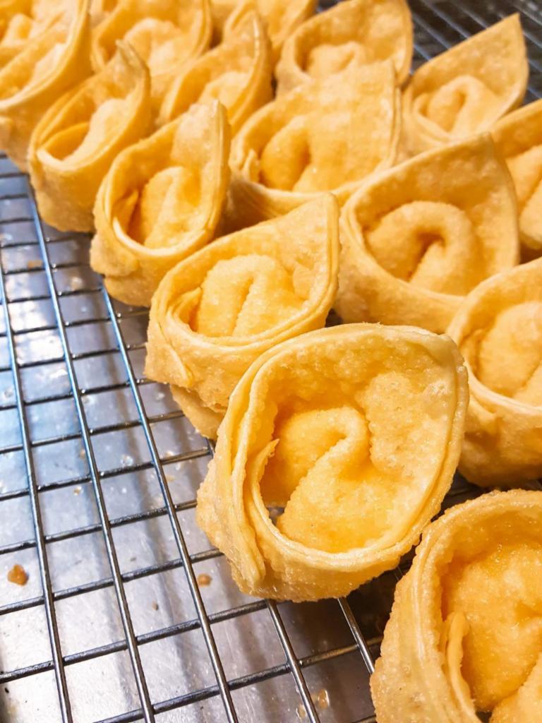 A8. 6 Pieces Crab Rangoon · A crispy wonton shell  with us tasty cream cheese​ filling .Serve with plum sauce.