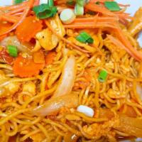 Spicy Noodle · Pan fried yellow noodle, egg, onion.green onion  and carrot. Spicy.