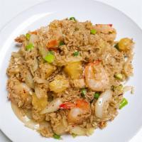 Pineapple Fried Rice · Meat ,egg, onions, pineapple, cashew nut and pea carrot.