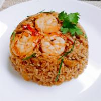 Tom Yum Fried Rice · Rice,  shrimps, onion, mushroom fried with lemongrass, tom yum paste lime juice, and homemad...