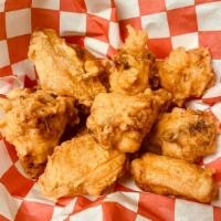Fried Chicken Wings · Cooked wing of a chicken coated in sauce or seasoning.