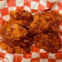 Seasoned Chicken Wings · Cooked wing of a chicken coated in sauce or seasoning.