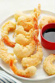 Shrimp Tempura · 6 pieces. Battered fried shrimp, served with homemade sweet and sour sauce.