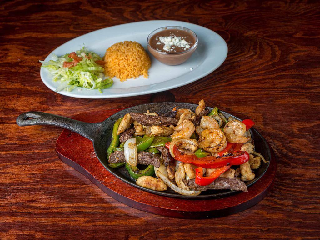 Las Tres Huasteka Special · Camaron, pollo, filet de pescado y carne asada. Roasted seasoned shrimp, chicken, fish filet and beef.