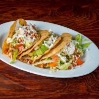 Tacos · Corn tortilla stuffed with your choice of meat.