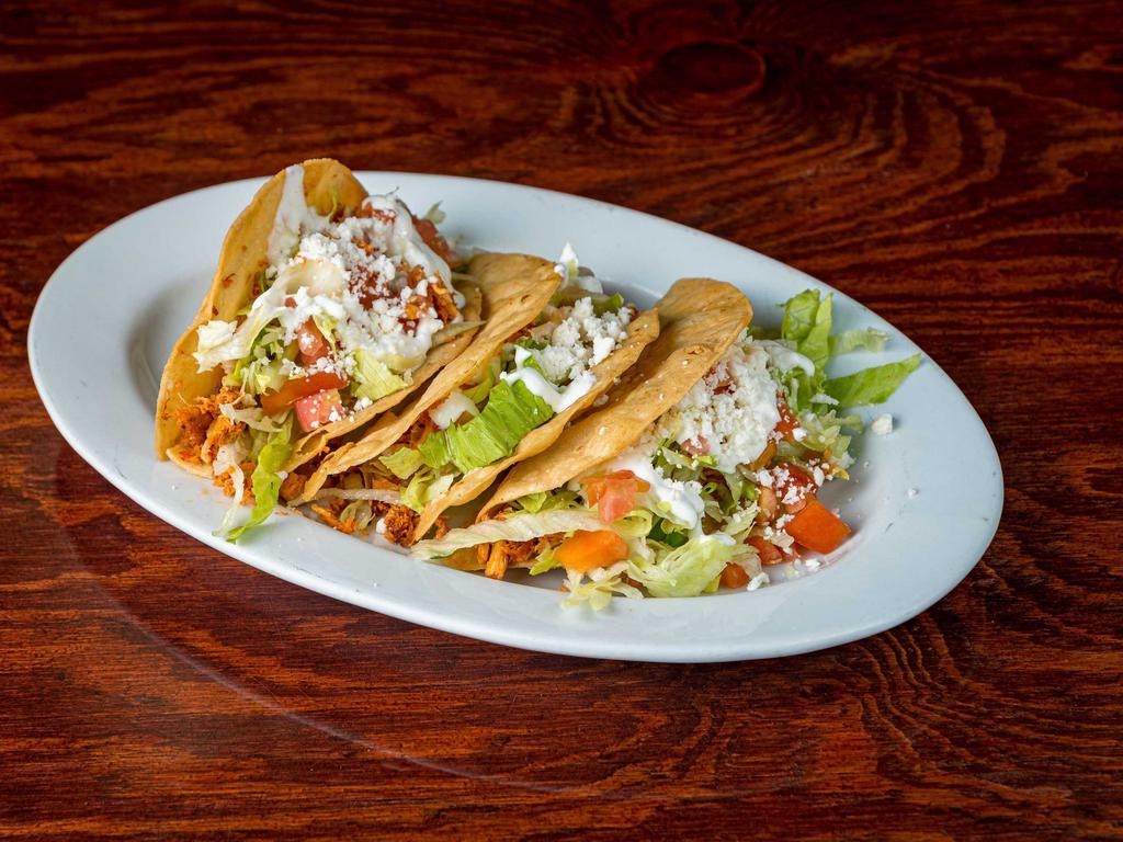 Tacos · Corn tortilla stuffed with your choice of meat.