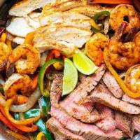 Fajitas · Seasoned beef, chicken or shrimp with onions, red and green peppers.