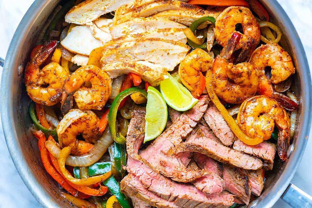 Fajitas · Seasoned beef, chicken or shrimp with onions, red and green peppers.