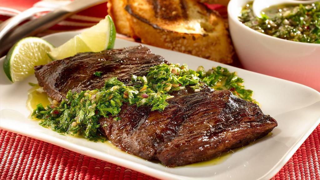 Churrasco · A juicy, grilled steak with a side salad.