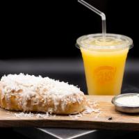 Cheese Roll (Enroladinho) · Sweet coconut bread filled with mozzarella cheese, topped with condensed milk & coconut flak...