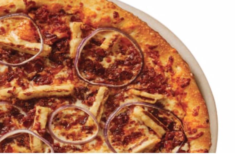 BBQ Chicken Pizza · A sweet barbecue sauce base, grilled chicken, red onions, crispy bacon with cheddar and mozzarella cheese.