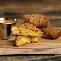 Classic Mac Bites · 4 Golden-fried mac & cheese bites served with house sauce for dunking