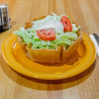 Classic Taco Salad · Ground beef or shredded chicken, flour tortilla shell, shredded cheese, lettuce sour cream, ...
