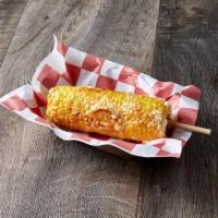 Traditional Elote · Traditional Mexican Style Corn topped with Butter, Cotija Cheese, Mayonnaise, and Chili Powd...