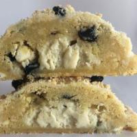 Lemon Blueberry Crumble · Lemon zest sugar cookie packed with blueberries, lemon shortbread bits and white chocolate c...