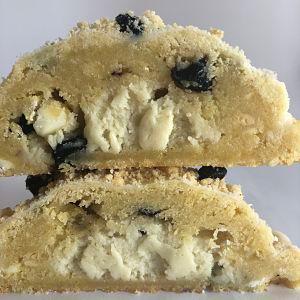 Lemon Blueberry Crumble · Lemon zest sugar cookie packed with blueberries, lemon shortbread bits and white chocolate chips...NY cheesecake filling...lemon crumble topping