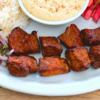 # 9 Shish Kabob · Marinated steak, rice, tomatoes, spiced onions, hummus, pickled turnips.

