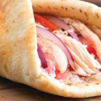 # 13 Roasted Chicken Wrap · Marinated chicken, tomatoes, garlic sauce wrapped in freshly baked pita bread.
