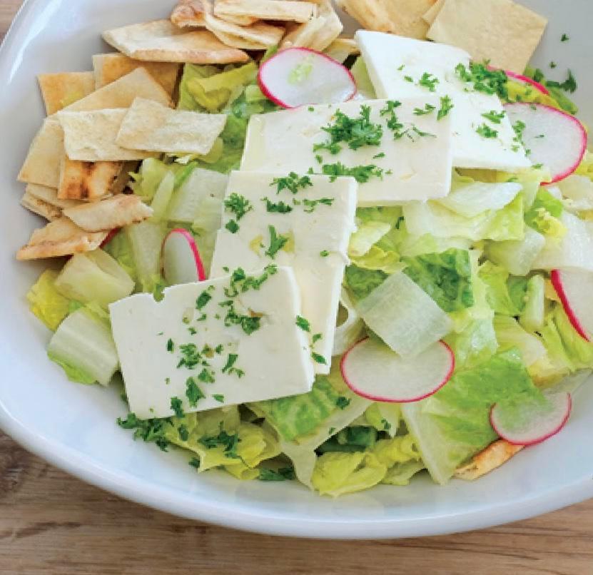 Tahini Caesar Salad · Romaine lettuce, vegan feta, garlic, roasted chickpeas.