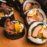 Mild Chicken Roll · Mild Chicken, Lettuce, Pickled Radish And Eggs All Wrapped In Seasoned Rice And Dried Seawee...