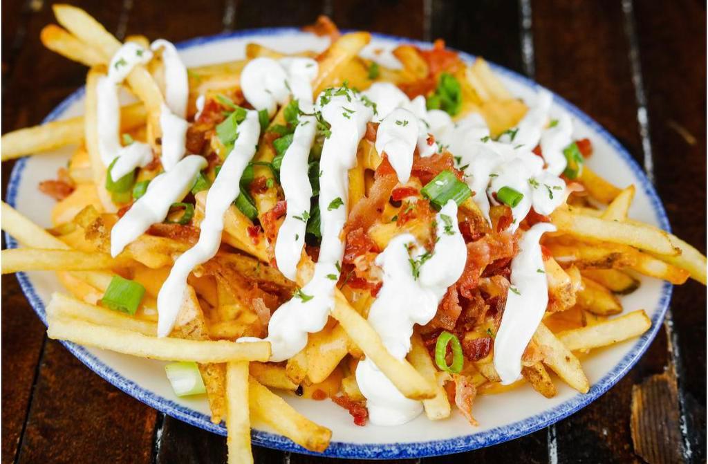 Loaded Fries · French fries topped with cheese sauce, bacon, chives and sour cream.