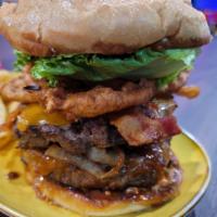 The Dancing Skull Burger · Our signature, two 8 oz. patties smothered in cheddar cheese, caramelized onions, sauteed mu...