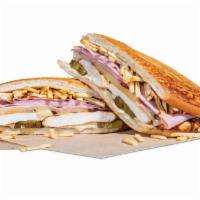The Grilled Chicken Cuban · Grilled chicken breast and sliced ham served on a Cuban roll with Swiss cheese, potato stick...