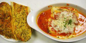 Lasagna · Fresh ground beef and tomato sauce blended with layers of pasta, ricotta cheese, mozzarella ...