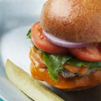 The Burger · Juicy beef patty, aged local cheddar, lettuce, onion, tomato on housemade brioche bun