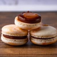 Caramel Macaron · White-Brown Caramel  Macarons are filled with homemade caramel and chocolate ganache.
Diet T...