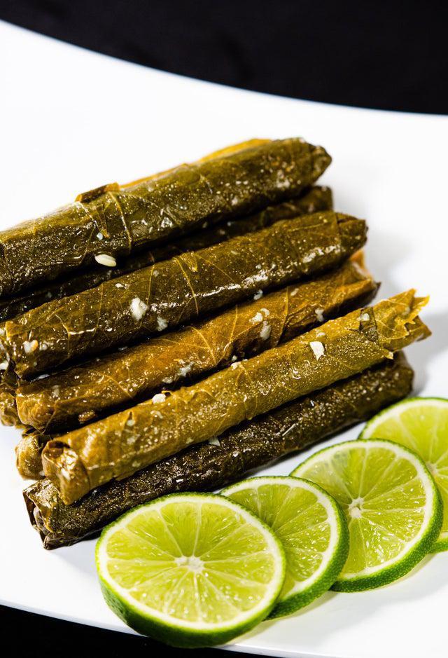 Grape Leaves · Handcrafted and stuffed grape leaves filled with rice and beef on lemon sauce.
