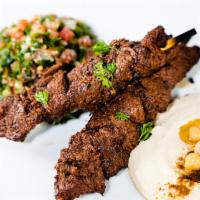 Steak Skewers · Our signature pinchos (Steak skewers) they come with 2 sides and pita bread.

