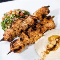 Chicken Skewers · Pinchos. Our signature pinchos (skewers) they come with 2 sides and pita bread.
