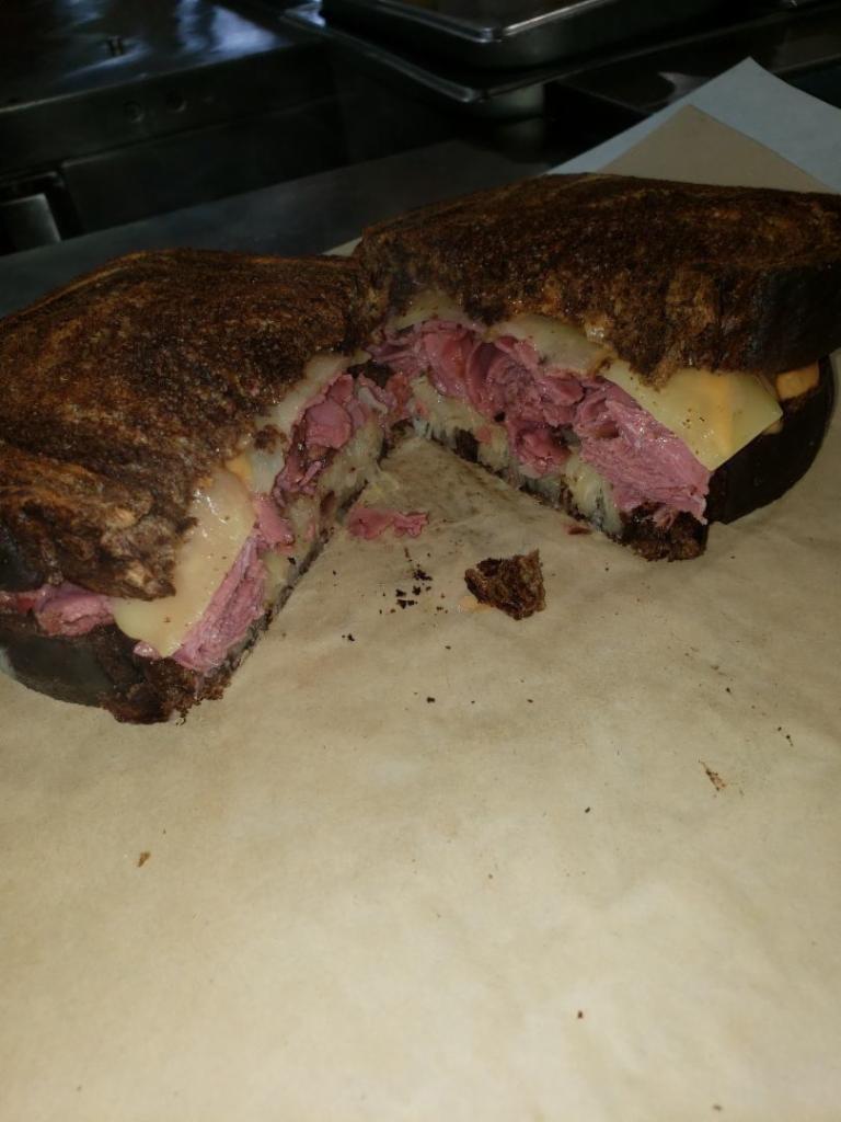 Reuben Sandwich · Thinly sliced pastrami with melted Swiss cheese, Kosher kraut, and 1000 Island dressing on toasted marble Rye.