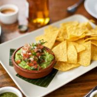 Small Guacamole & Chips · House made guacamole topped with pico de gallo served with a basket of tortilla chips.