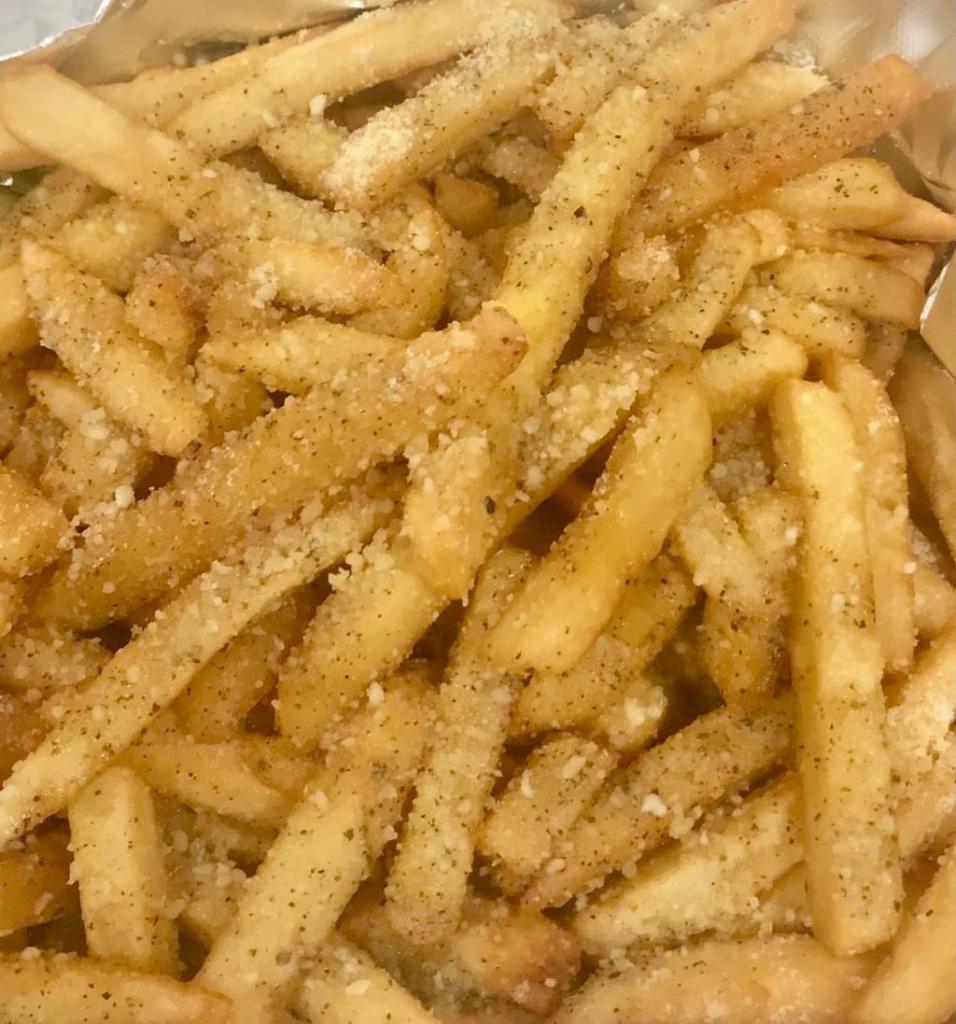 Zuba Fries · French fries shakin' with your choice of Buffalo sauce or garlic Parmesan sauce.