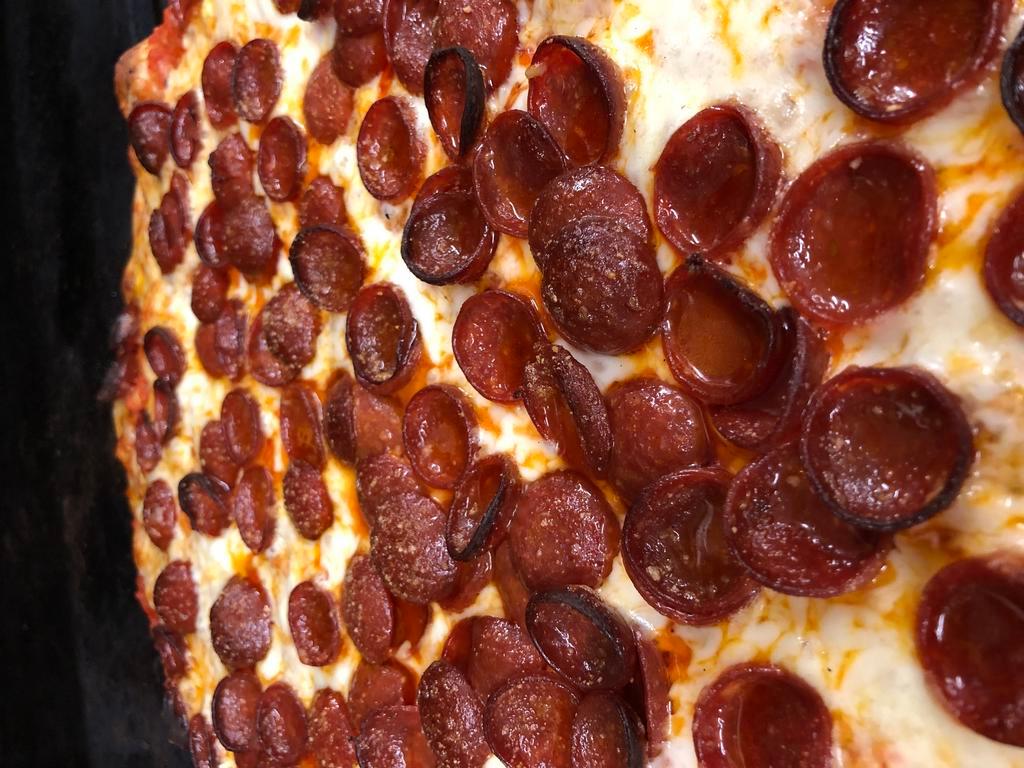 New York Style Pizza · Thin pizza with mini pepperoni (cup and char pepperoni).